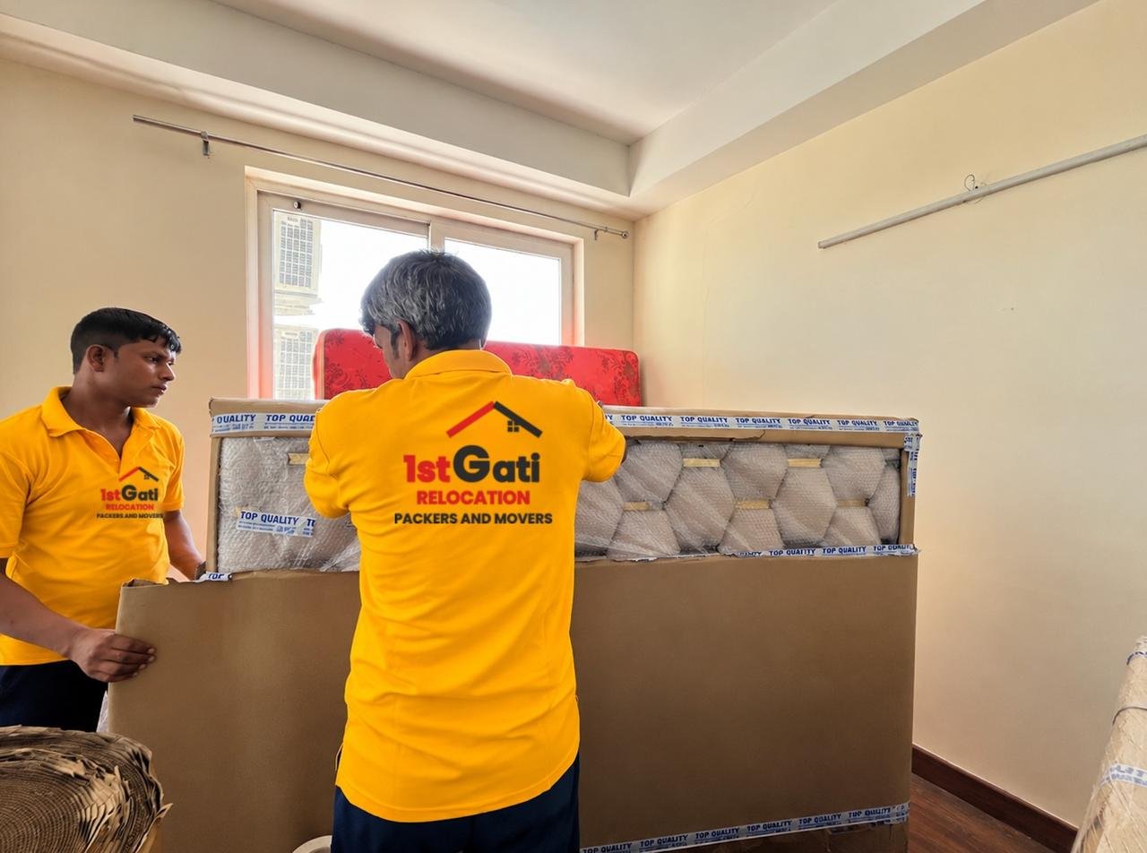 1stGati crew wrapping furniture with stretch film
