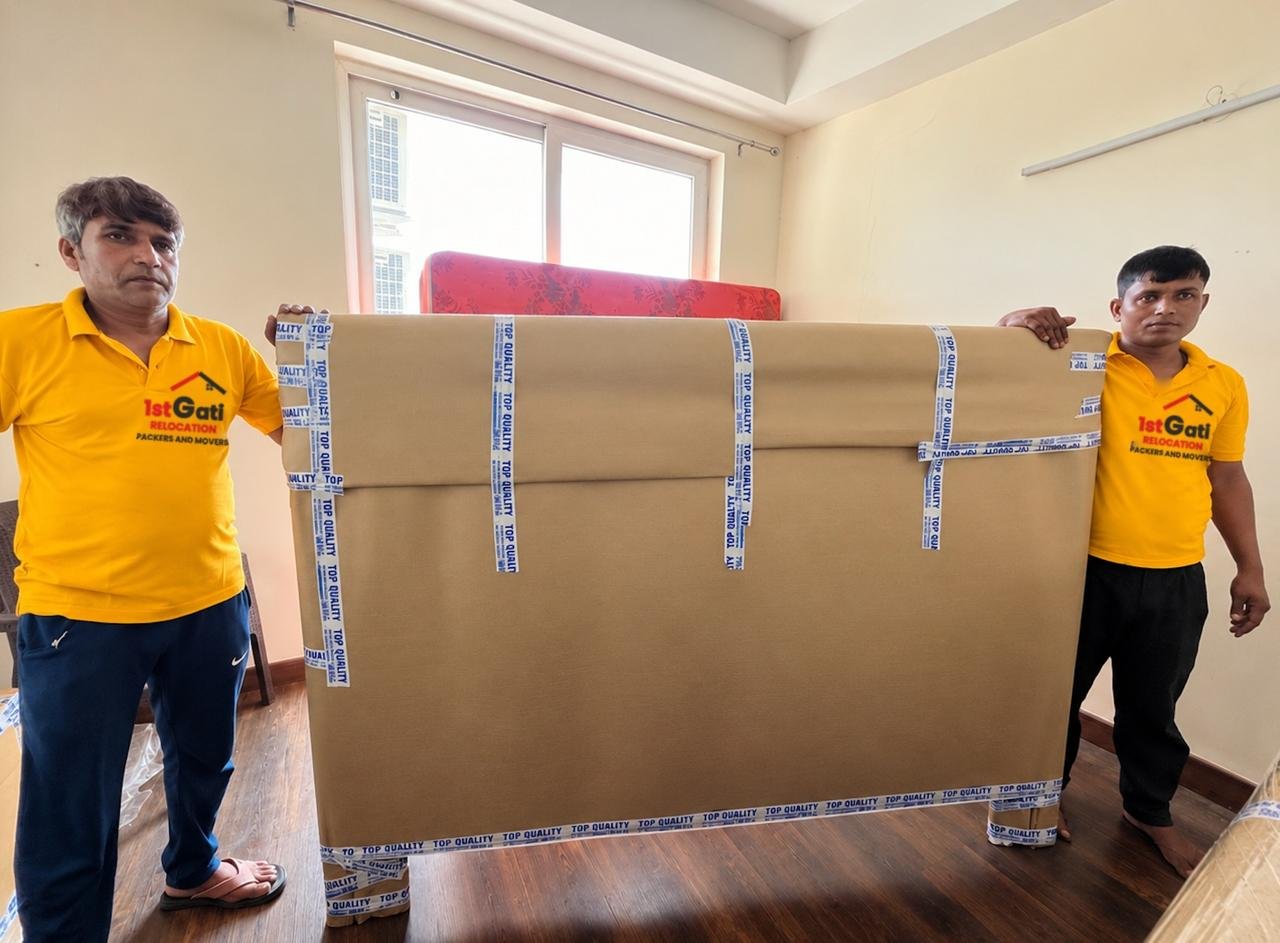 Team loading sealed cartons into the moving truck