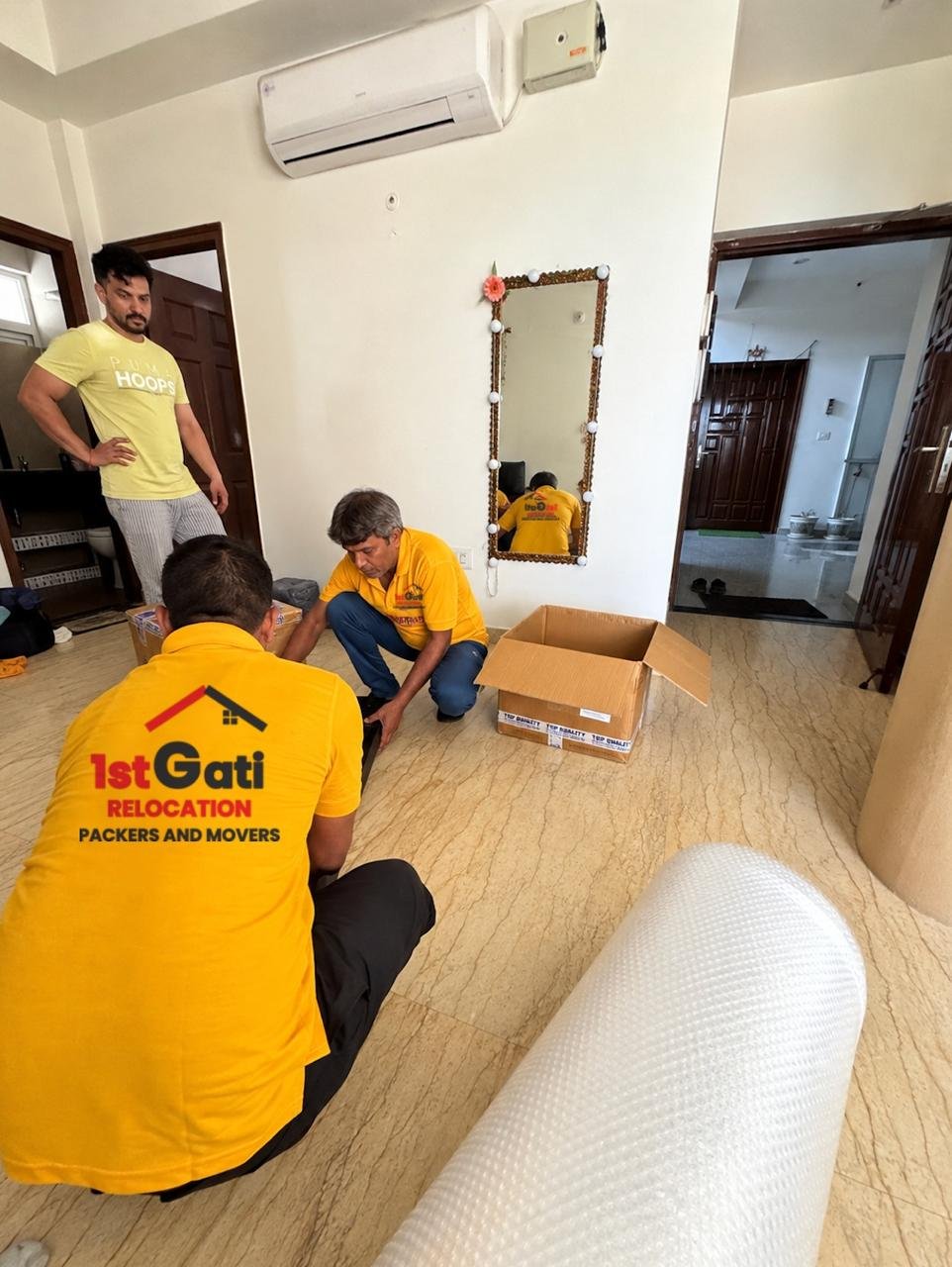 Crew securing a sofa inside the vehicle