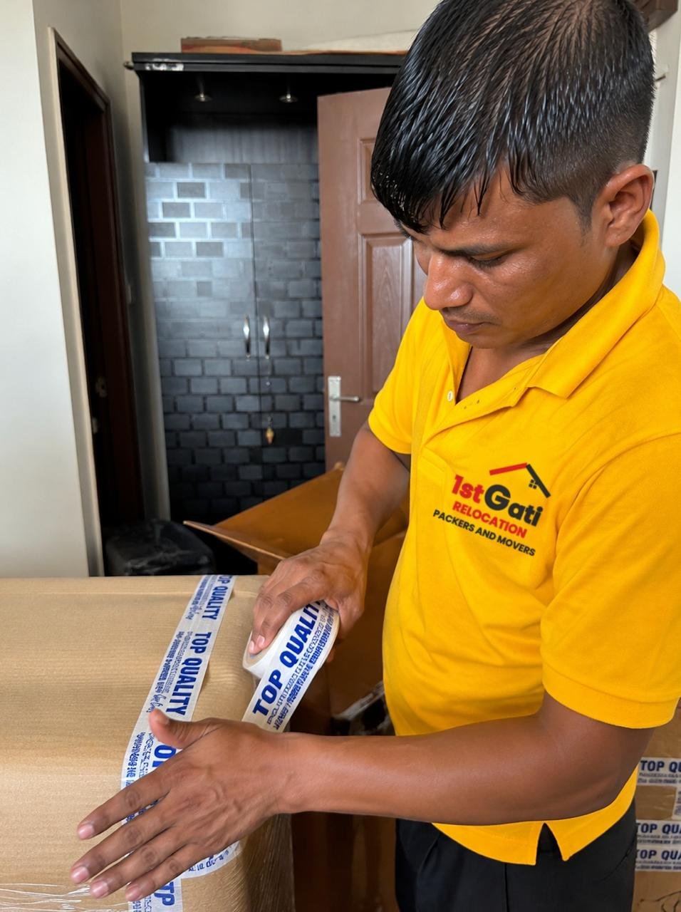 Packed cartons stacked and labelled by room